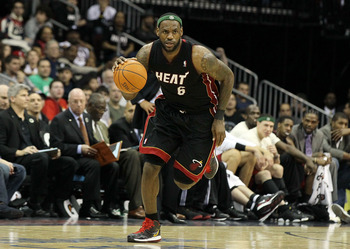 NEWARK, NJ - APRIL 03:  LeBron James #6 of the Miami Heat dribbles the ball upcourt against the New Jersey Nets at the Prudential Center on April 3, 2011 in Newark, New Jersey.The Heat defeated the Nets 108-94.NOTE TO USER: User expressly acknowledges and