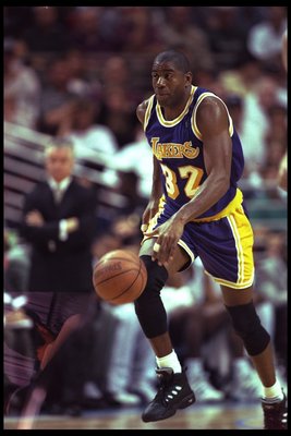 26 Mar 1996: Guard Magic Johnson of the Los Angeles Lakers moves the ball against the Orlando Magic during a game played at the Orlando Arena in Orlando, Florida. The Lakers won the game, 113-91. Mandatory Credit: ALLSPORT USA /Allsport