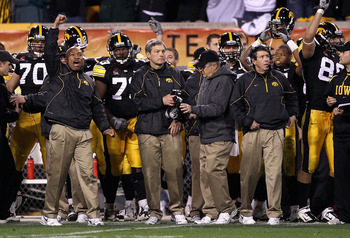 TEMPE, AZ - DECEMBER 28:  Head coach Kirk Ferentz (C) of the Iowa Hawkeyes celebrates with teammates after defeating the Missouri Tigers in the Insight Bowl at Sun Devil Stadium on December 28, 2010 in Tempe, Arizona.  The Hawkeyes defeated the Tigers 27-