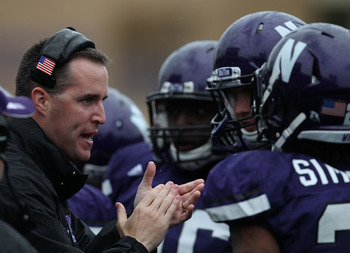 EVANSTON, IL - OCTOBER 23: Head coach Pat Fitzgerald of the Northwestern Wildcats encourages his team as they take on the Michigan State Spartans at Ryan Field on October 23, 2010 in Evanston, Illinois. Michigan State defeated Northwestern 35-27. (Photo b