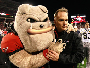 ATHENS, GA - NOVEMBER 27:  Head coach Mark Richt and Hairy, mascot of the Georgia Bulldogs, celebrate their 42-34 win over the Georgia Tech Yellow Jackets at Sanford Stadium on November 27, 2010 in Athens, Georgia.  (Photo by Kevin C. Cox/Getty Images)