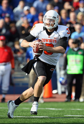 LAWRENCE, KS - NOVEMBER 20:  Quarterback Brandon Weeden #3 of the Oklahoma State Cowboys in action during the game against  the Kansas Jayhawks on November 20, 2010 at Memorial Stadium in Lawrence, Kansas.  (Photo by Jamie Squire/Getty Images)
