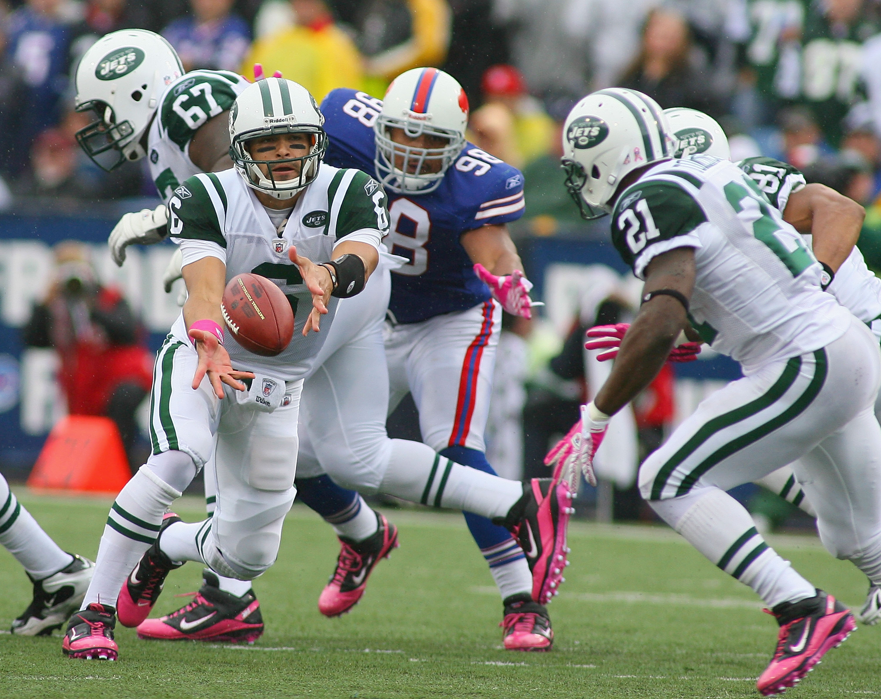 New York Giants Jason Piere-Paul and Justin Tuck (91) chase Philadelphia  Eagles Michael Vick as he runs for a 22 yard gain in the fourth quarter at  New Meadowlands Stadium in week