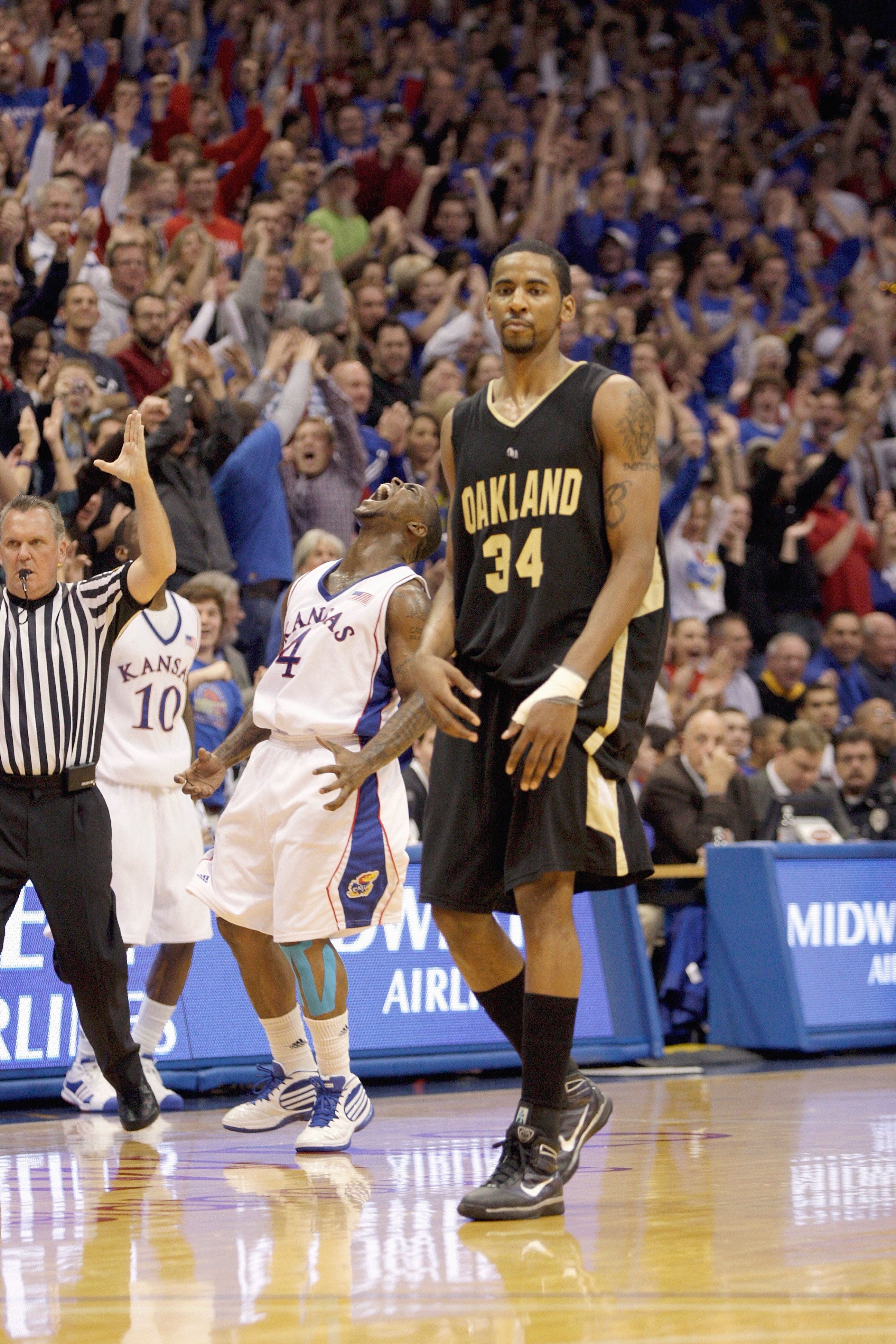 LAWRENCE, KS - NOVEMBER 25:  Keith Benson #34 of the Oakland Golden Grizzlies walks on the court as fans of the Kansas Jayhawks cheer on November 25, 2009 at Allen Fieldhouse in Lawrence, Kansas. (Photo by Jamie Squire/Getty Images)