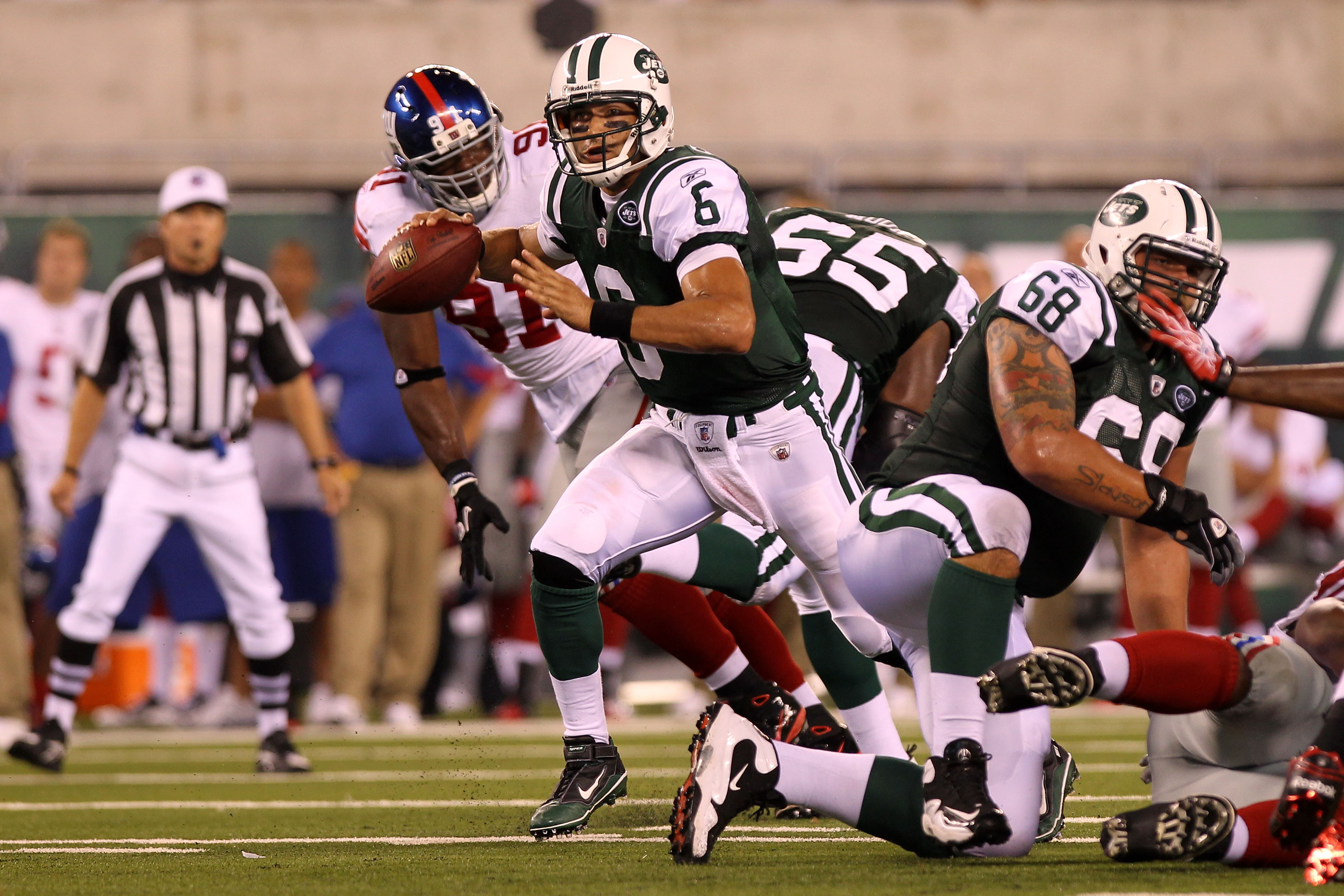 New York Giants Jason Pierre-Paul puts pressure on Washington Redskins  quarterback Donovan McNabb in third quarter at New Meadowlands Stadium in  week 13 of the NFL in East Rutherford, New Jersey on