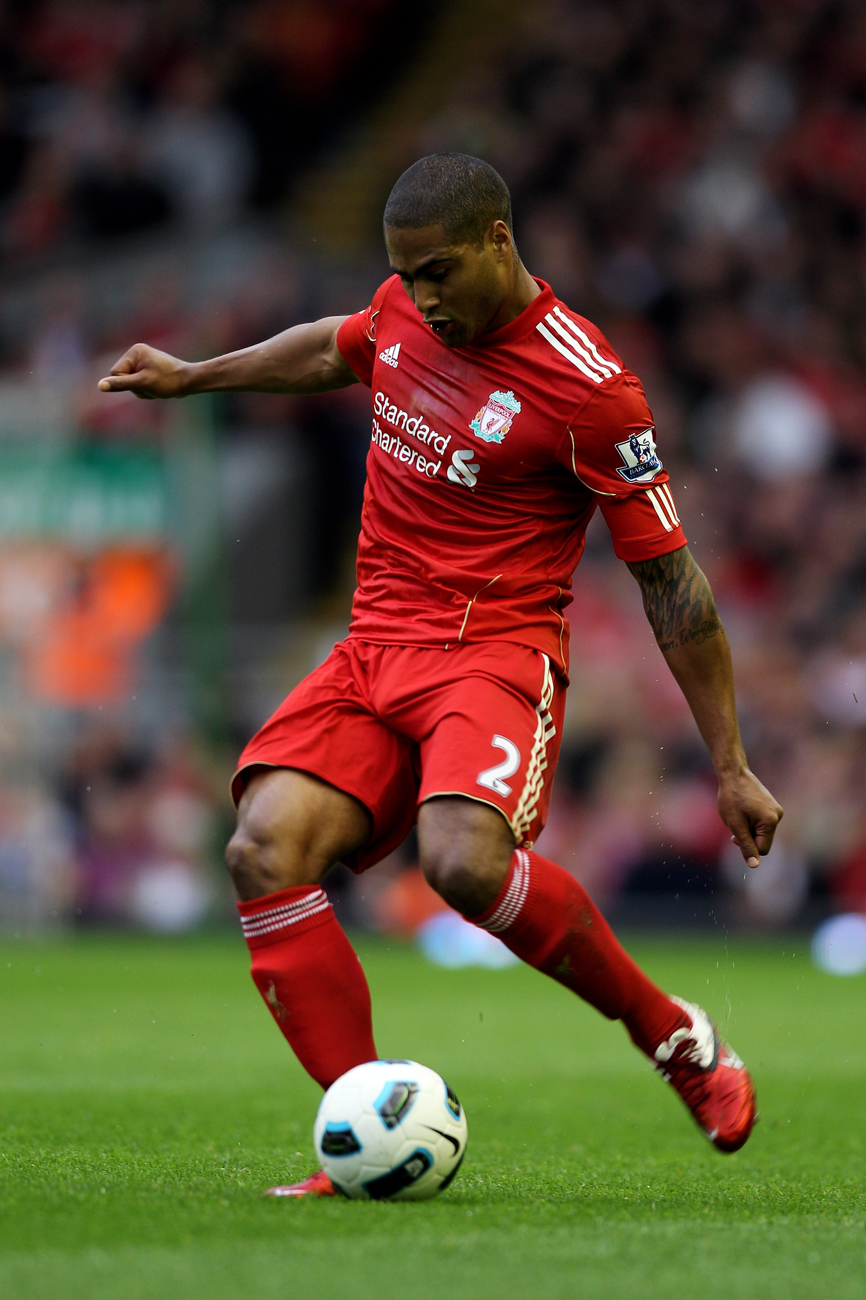 LIVERPOOL, ENGLAND - MAY 15:  Glen Johnson of Liverpool crosses the ball during the Barclays Premier League match between Liverpool and Tottenham Hotspur at Anfield on May 15, 2011 in Liverpool, England.  (Photo by Michael Steele/Getty Images)