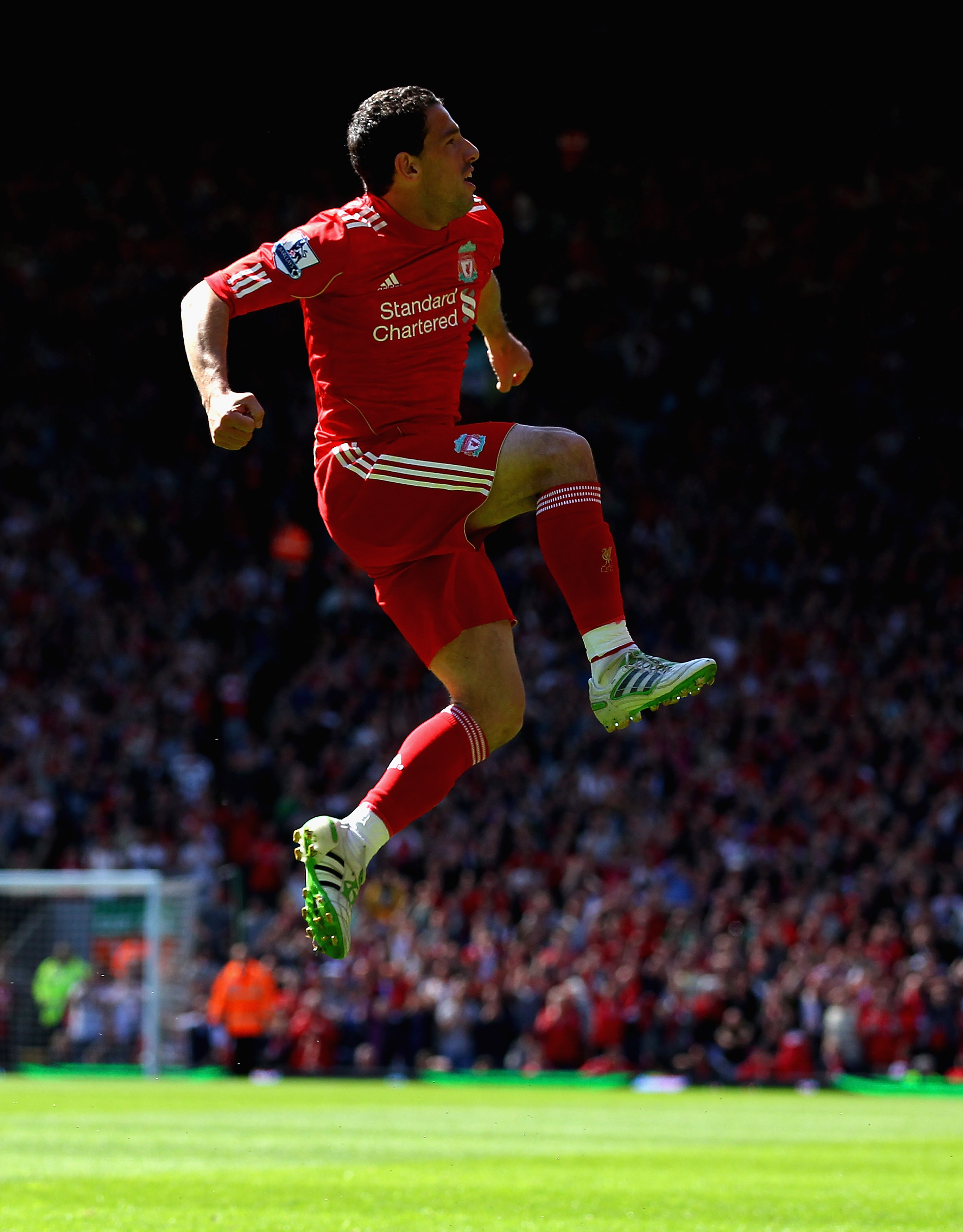 LIVERPOOL, ENGLAND - MAY 01:  Maxi Rodriguez of Liverpool leaps into the air to celebrate after scoring the first goal during the Barclays Premier League match between Liverpool  and Newcastle United at Anfield on May 1, 2011 in Liverpool, England.  (Phot