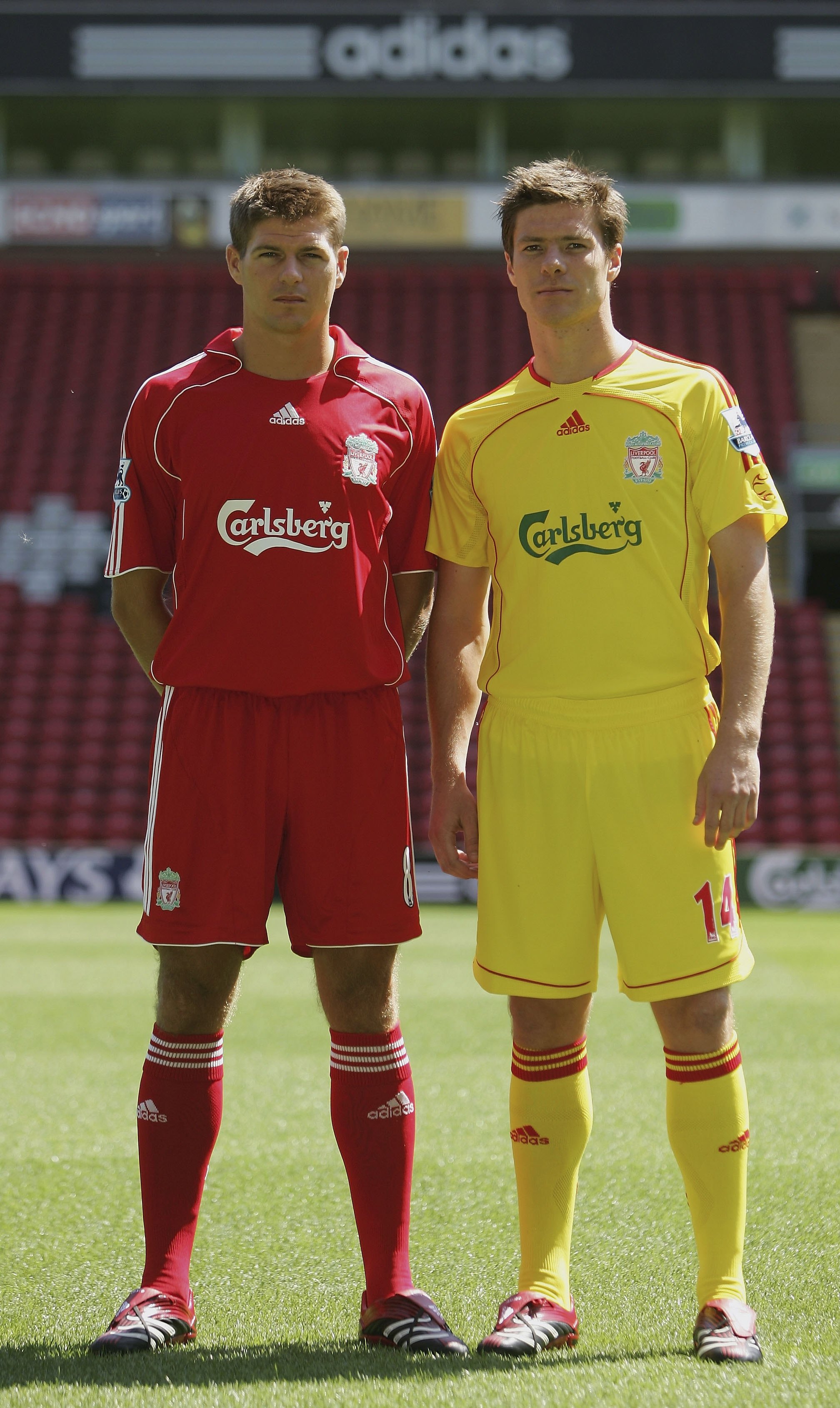LIVERPOOL, UNITED KINGDOM - JULY 24:  Liverpool captain Steven Gerrard (L) and Xabi Alonso show off the new home and away kits during the Liverpool FC Adidas Kit Launch at Anfield on July 24, 2006 in Liverpool, England.  (Photo by Ian Walton/Getty Images