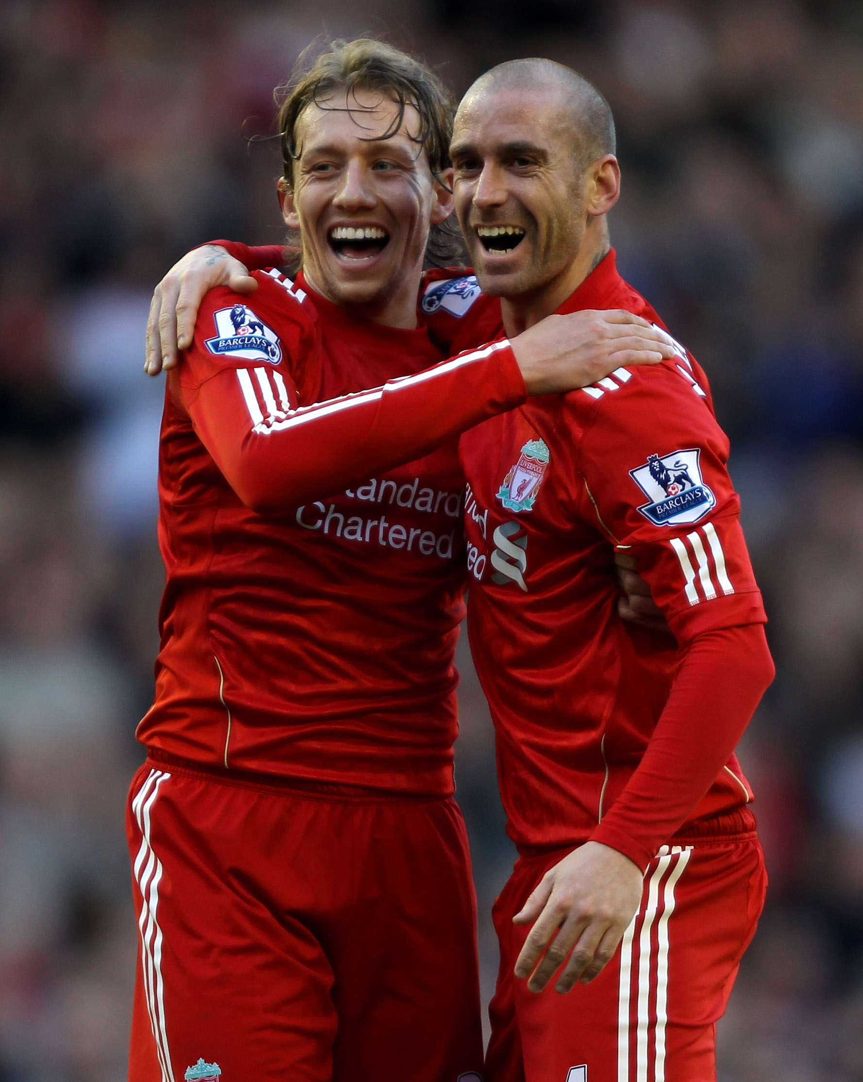 LIVERPOOL, ENGLAND - FEBRUARY 12:  Raul Meireles (R) of Liverpool celebrates scoring the opening goal with team mate Lucas during the Barclays Premier League match between Liverpool and Wigan Athletic at Anfield on February 12, 2011 in Liverpool, England.