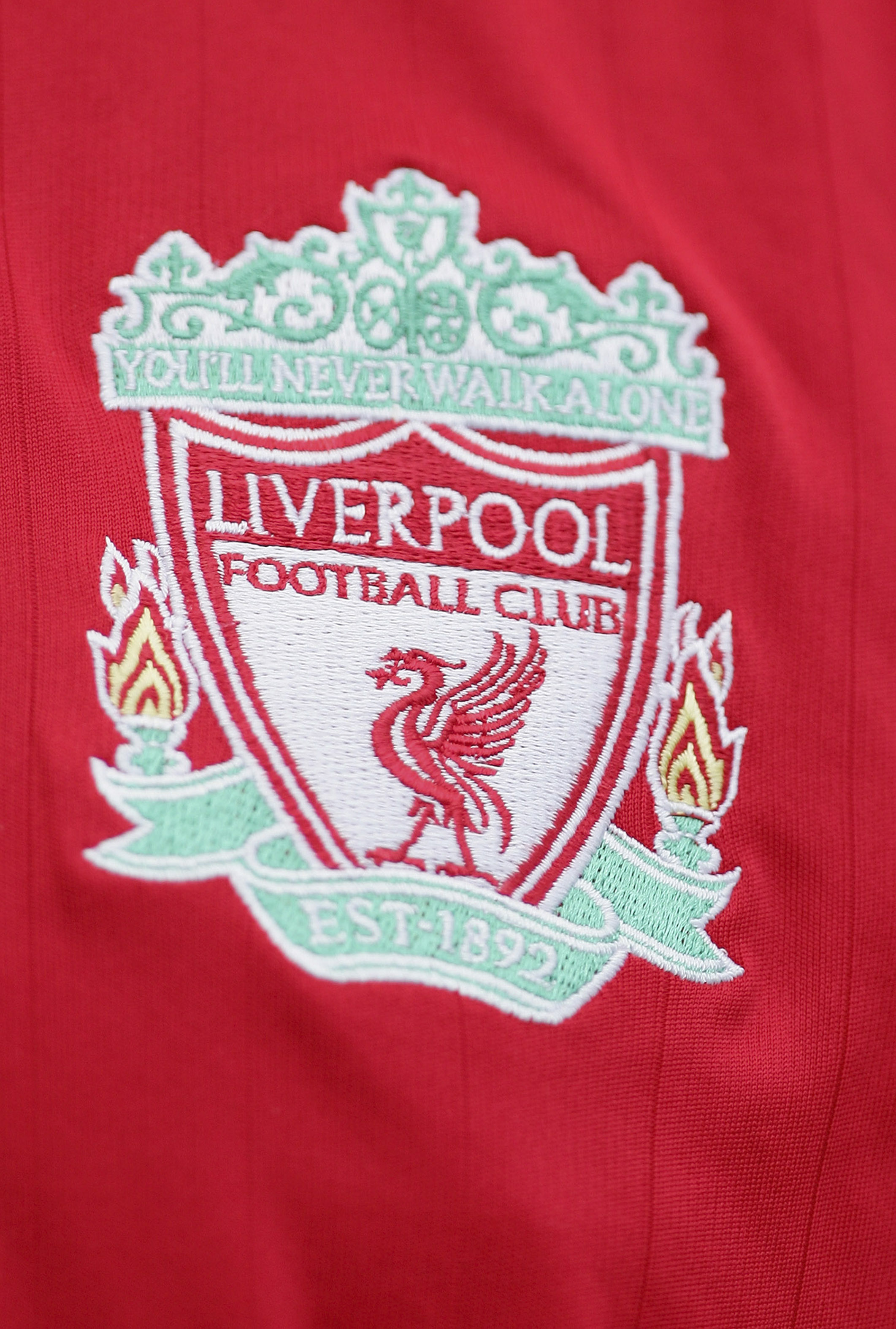 LIVERPOOL, UNITED KINGDOM - SEPTEMBER 23: The Liverpool badge on a fans shirt during the Barclays Premiership match between Liverpool and Tottenham Hotspur at Anfield on September 23, 2006 in Liverpool, England.  (Photo by Laurence Griffiths/Getty Images)