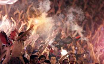 27 Oct 2000:  Flamengo fans let off flares in the stands during the Flamengo  v Vasco de Gama Joao Havelange Cup match played at the Maracana Stadium, Rio de Janeiro. Mandatory Credit: Allsport/ALLSPORT