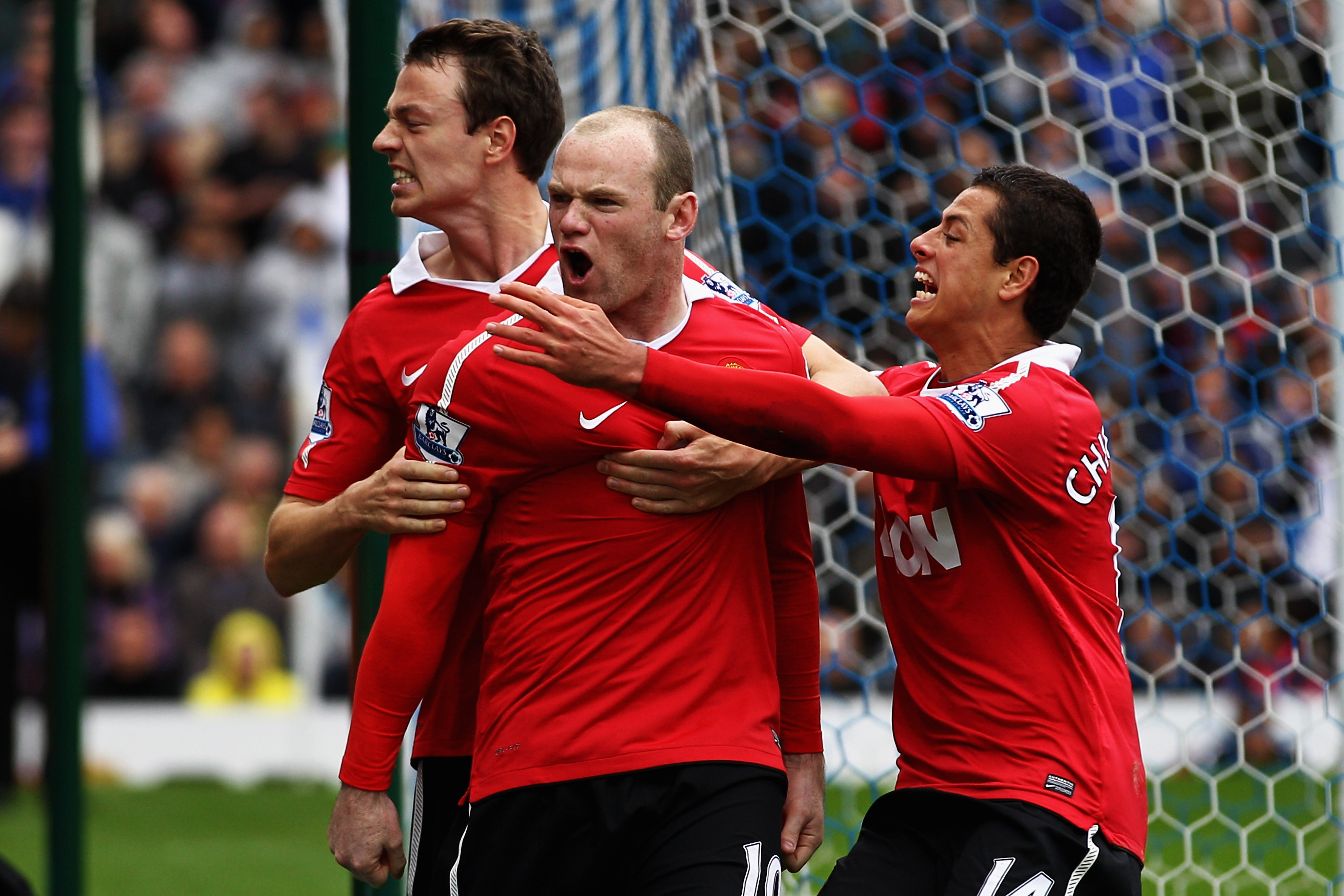 BLACKBURN, ENGLAND - MAY 14:  Wayne Rooney of Manchester United celebrates with team mates after scoring a penalty during the Barclays Premier League match between Blackburn Rovers and Manchester United at Ewood park on May 14, 2011 in Blackburn, England.