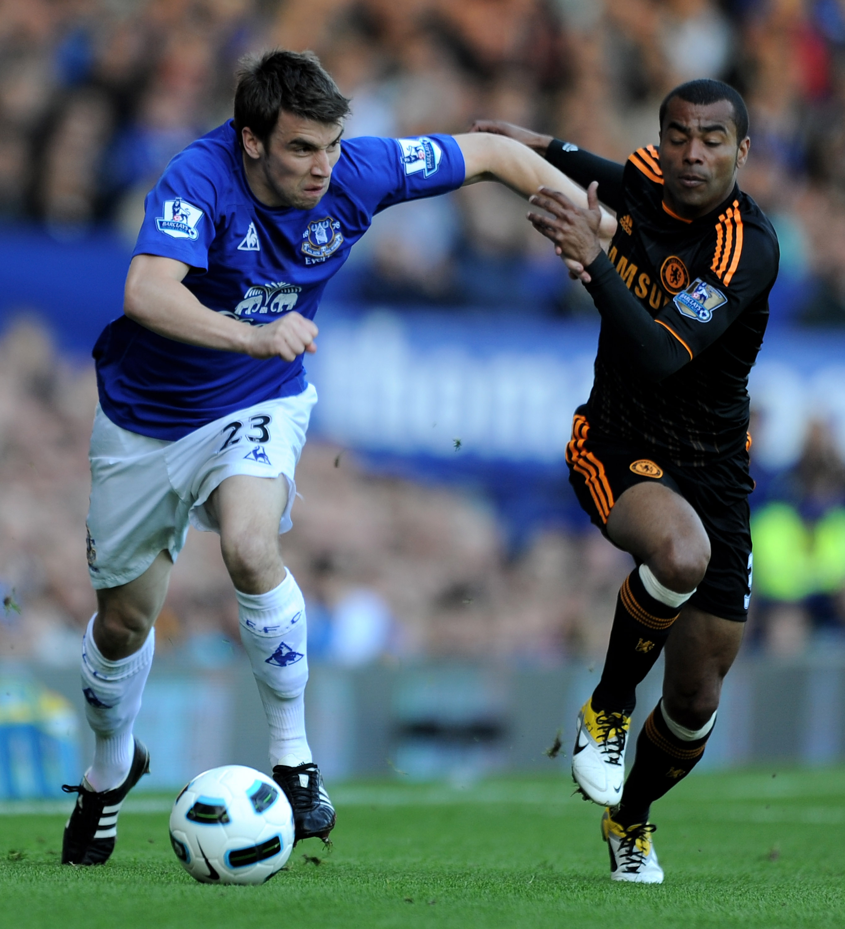 LIVERPOOL, ENGLAND - MAY 22:   Ashley Cole of Chelsea competes with Seamus Coleman of Everton during the Barclays Premier League match between Everton and Chelsea at Goodison Park on May 22, 2011 in Liverpool, England.  (Photo by Chris Brunskill/Getty Ima