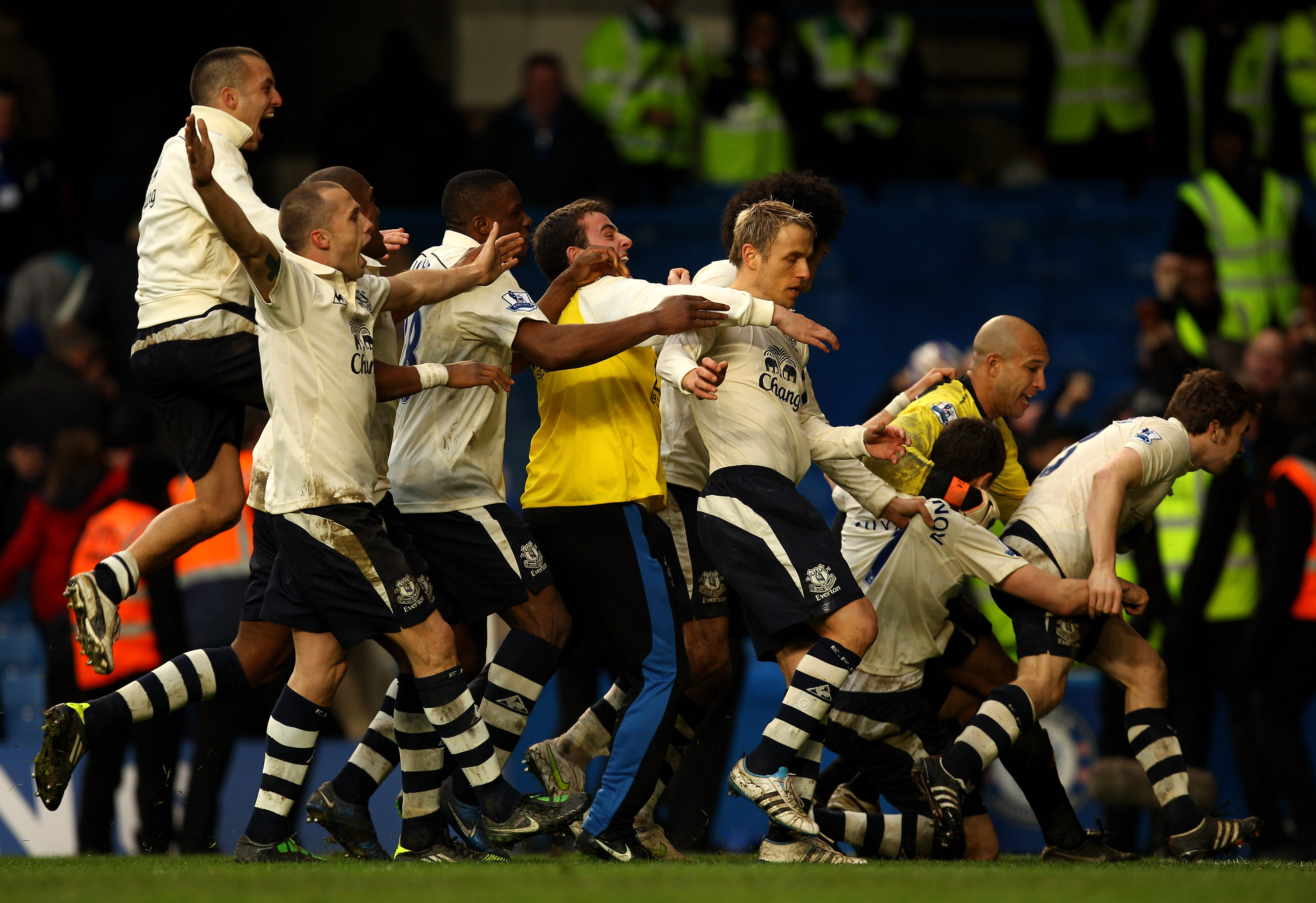 LONDON, ENGLAND - FEBRUARY 19:  Everton captain Phil Neville (C) celebrates with teammates after scoring the winning penalty to put his team through 4-3 on penalties during the FA Cup sponsored by E.ON 4th round replay match between Chelsea and Everton at