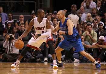 MIAMI, FL - DECEMBER 20:  Dwyane Wade #3 of the Miami Heat posts up Jason Kidd #2 of the Dallas Mavericks during a game at American Airlines Arena on December 20, 2010 in Miami, Florida. NOTE TO USER: User expressly acknowledges and agrees that, by downlo
