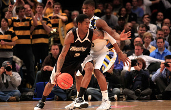 NEW YORK, NY - MARCH 08: Marshon Brooks #2 of the Providence Friars dribbles the ball against Jimmy Butler #33 of the Marquette Golden Eagles during the first round of the 2011 Big East Men's Basketball Tournament presented by American Eagle Outfitters at