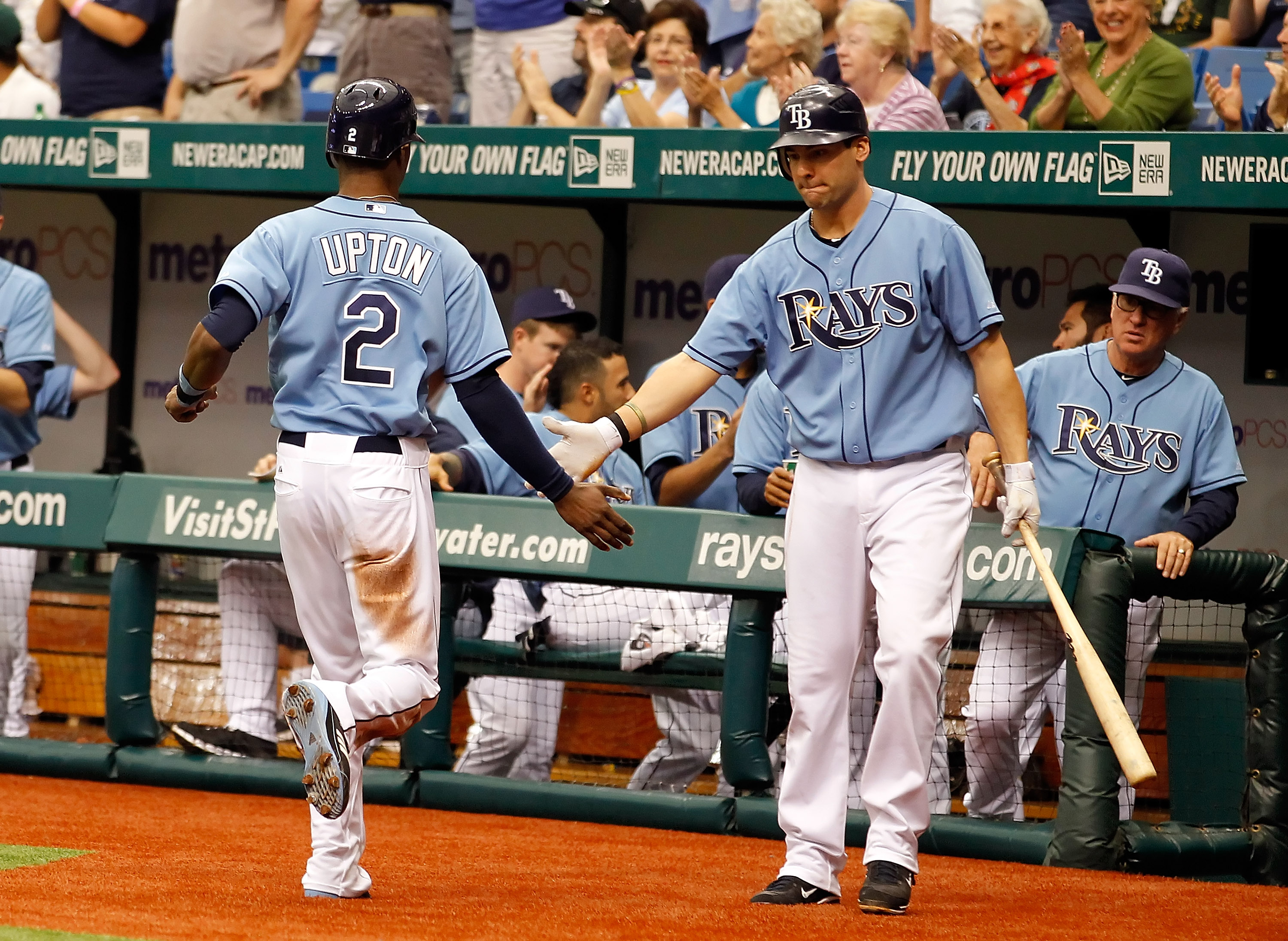 ST. PETERSBURG, FL - MAY 01:  Outfielder B.J. Upton #2 of the Tampa Bay Rays is congratulated by Casey Kotchman #11 after scoring a run against the Los Angeles Angels of Anaheim during the game at Tropicana Field on May 1, 2011 in St. Petersburg, Florida.