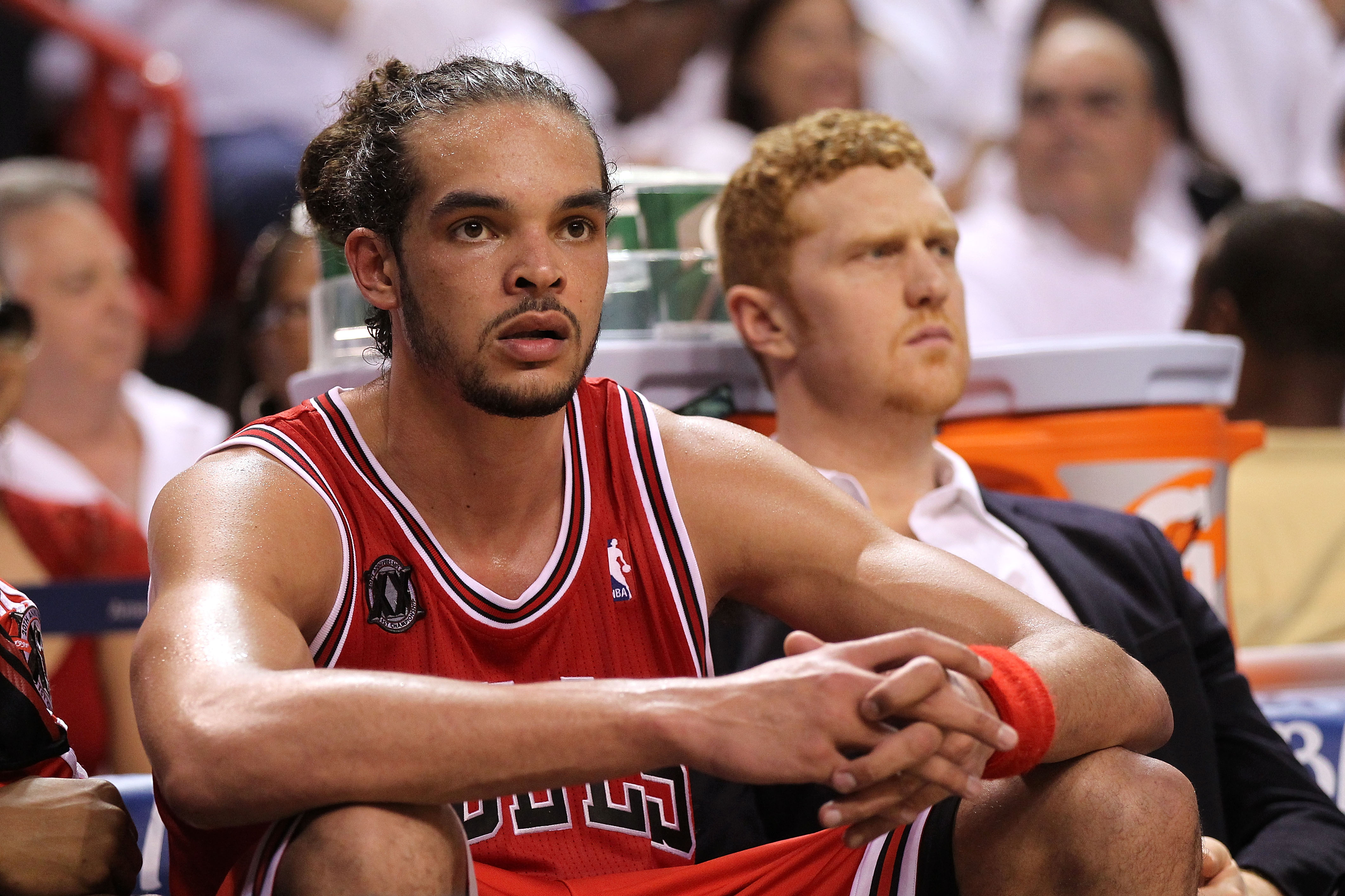 MIAMI, FL - MAY 22:  Joakim Noah #13 (L) and Brian Scalabrine #24 of the Chicago Bulls look on dejected from the bench late in the fourth quarter against the Miami Heat in Game Three of the Eastern Conference Finals during the 2011 NBA Playoffs on May 22,