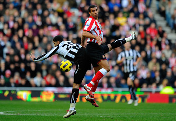 SUNDERLAND, ENGLAND - JANUARY 16:  Newcastle player Leon Best is challenged by Anton Ferdinand during the Barclays Premier League match between Sunderland and Newcastle United at Stadium of Light on January 16, 2011 in Sunderland, England.  (Photo by Stu