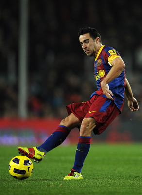 BARCELONA, SPAIN - JANUARY 02:  Xavi Hernandez of Barcelona passes the ball during the La Liga match between Barcelona and Levante UD at Camp Nou on January 2, 2011 in Barcelona, Spain. Barcelona won 2-1.  (Photo by David Ramos/Getty Images)