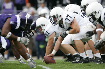 EVANSTON, IL - SEPTEMBER 24:  Center E.Z. Smith #77 of the Penn State Nittany Lions gets set to snap the ball against the Northwestern Wildcats defense September 24, 2005 at Ryan Field in Evanston, Illinois.  Penn State won 34-29.   (Photo by Brian Bahr/G
