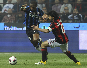 MILAN, ITALY - APRIL 02: (L - R) Samuel Eto'o of Inter competes with Gennaro Gattuso of Milan during the Serie A match between AC Milan and FC Internazionale Milano at Stadio Giuseppe Meazza on April 2, 2011 in Milan, Italy.  (Photo by Dino Panato/Getty I
