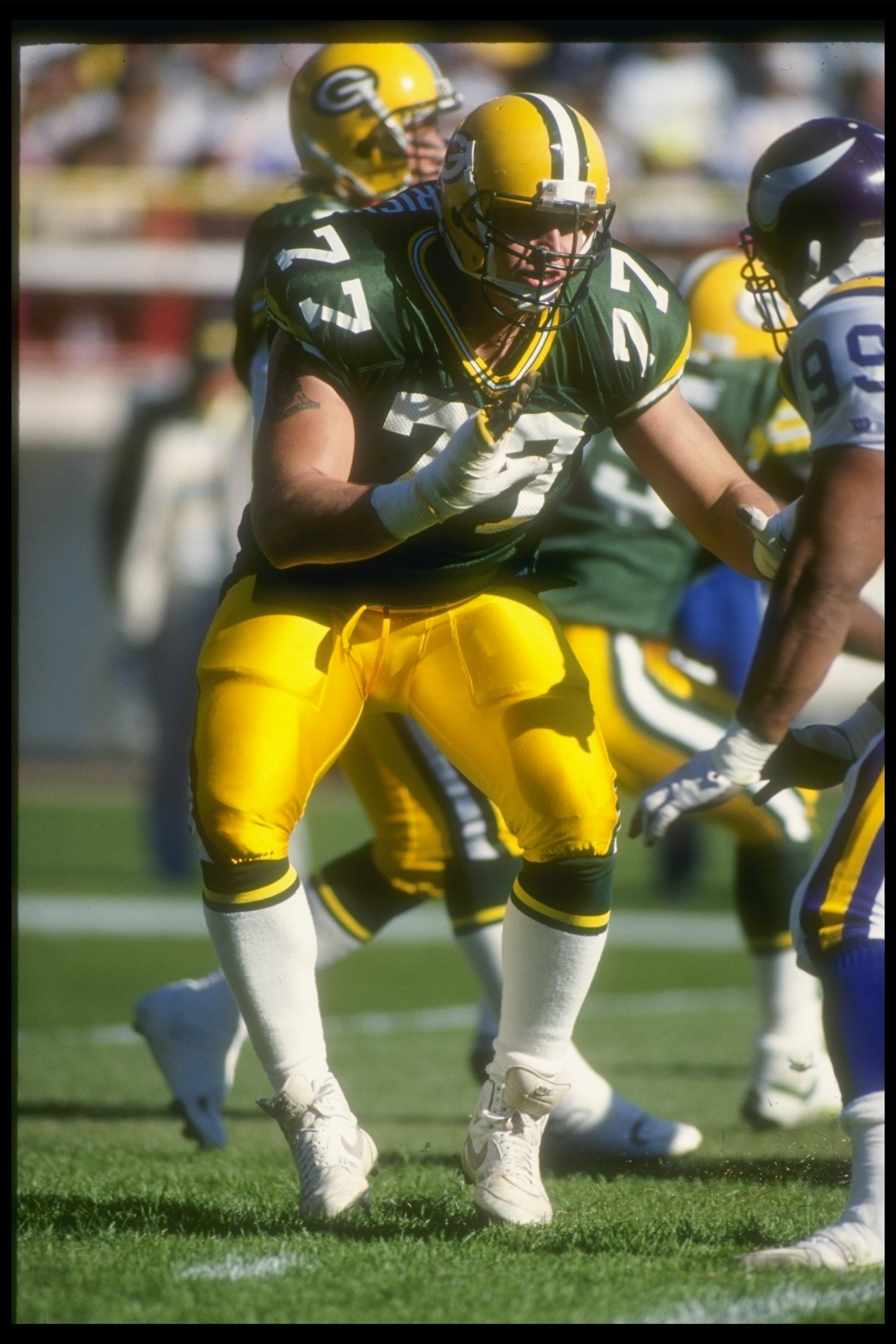 Green Bay Packers holder B.J. Sander watches as kicker Ryan