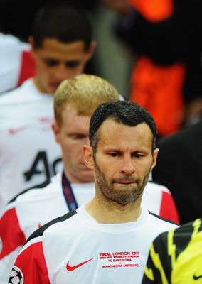 LONDON, ENGLAND - MAY 28:  Ryan Giggs of Manchester United looks dejected after defeat in the UEFA Champions League final between FC Barcelona and Manchester United FC at Wembley Stadium on May 28, 2011 in London, England.  (Photo by Clive Mason/Getty Ima