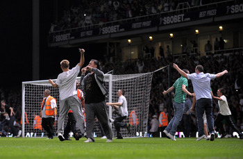 LONDON, ENGLAND - AUGUST 25:  Fans invade the pitch during the Carling Cup second round match between West Ham United and Millwall at Upton Park on August 25, 2009 in London, England.  . Violence broke out between West Ham and Millwall supporters, prior t