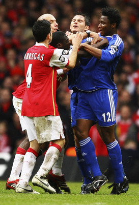 CARDIFF, UNITED KINGDOM - FEBRUARY 25:  Referee Howard Webb attempts to break up a brawl between the Arsenal and Chelsea players during the Carling Cup Final match between Chelsea and Arsenal at the Millennium Stadium on February 25, 2007 in Cardiff, Wale