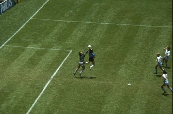 22 Jun 1986:  Diego Maradona of Argentina handles the ball past Peter Shilton of England to score the opening goal of the World Cup Quarter Final at the Azteca Stadium in Mexico City, Mexico. Argentina won 2-1. \ Mandatory Credit: Allsport UK /Allsport