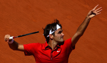 PARIS, FRANCE - MAY 23:  Roger Federer of Switzerland serves during the men's singles first round match between Feliciano Lopez of Spain and Roger Federer of Switzerland on day two of the French Open at Roland Garros on May 23, 2011 in Paris, France.  (Ph