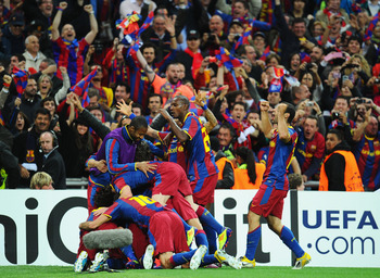LONDON, ENGLAND - MAY 28:  David Villa of FC Barcelona is mobbed by teammates as they celebrate after he scores their third goal during the UEFA Champions League final between FC Barcelona and Manchester United FC at Wembley Stadium on May 28, 2011 in Lon