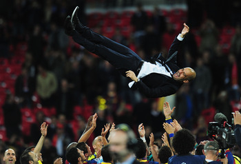 LONDON, ENGLAND - MAY 28:  Josep Guardiola manager of FC Barcelona is thrown in the air as Barcelona celebrate victory in UEFA Champions League final between FC Barcelona and Manchester United FC at Wembley Stadium on May 28, 2011 in London, England.  (Ph