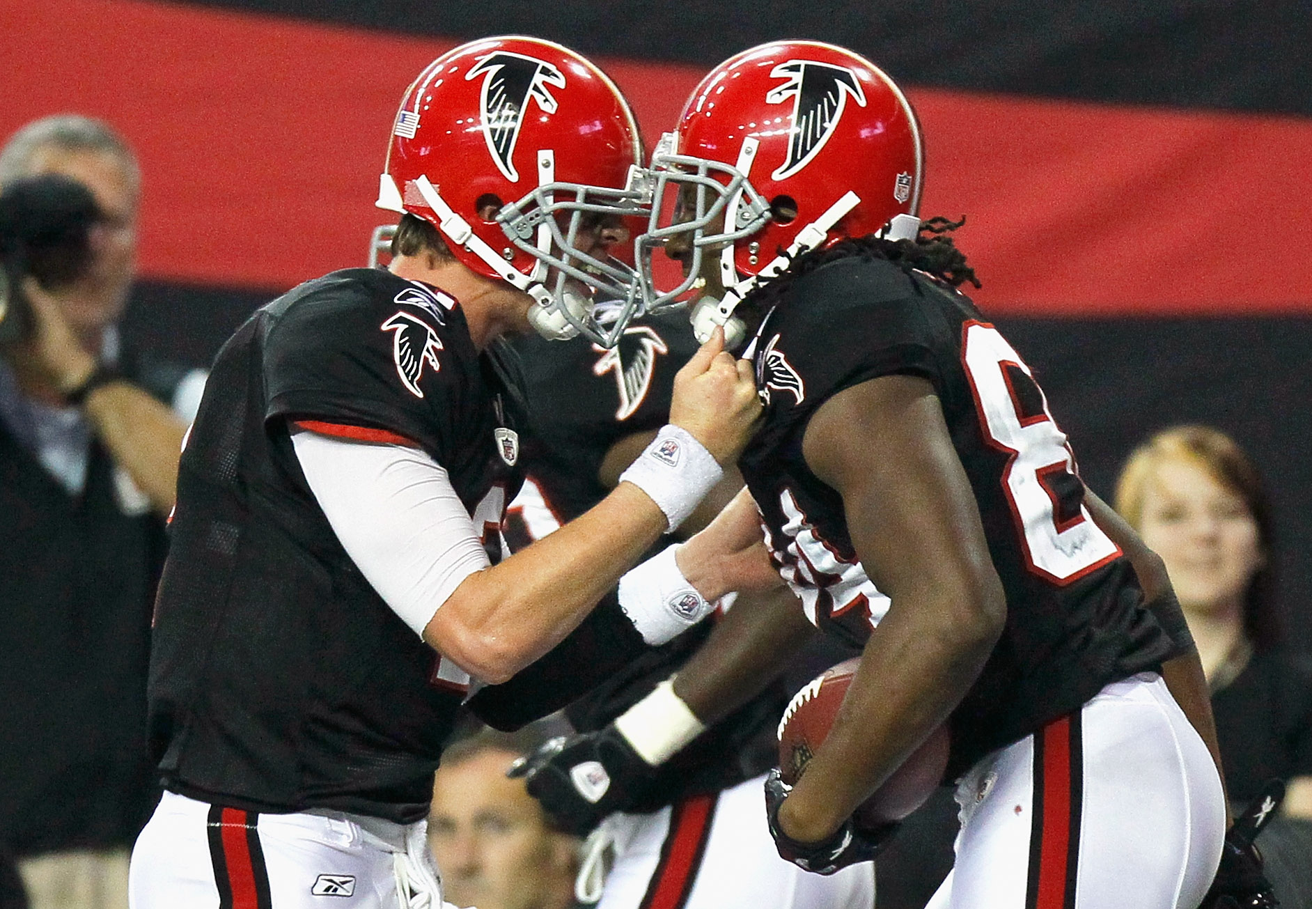 Atlanta Falcons' Julio Jones (11) celebrates his touchdown over the St.  Louis Rams with teammate Drew Davis (19) during the first half of the  Falcons' home opener at the Georgia Dome in