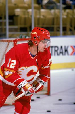INGLEWOOD, CA - 1988:  Hakan Loob #12 of the Calgary Flames skates during warm-ups prior to a game against the Los Angeles Kings in the 1988 NHL season at the Great Western Forum in Inglewood, California.  (Photo by Tim DeFrisco/Getty Images)