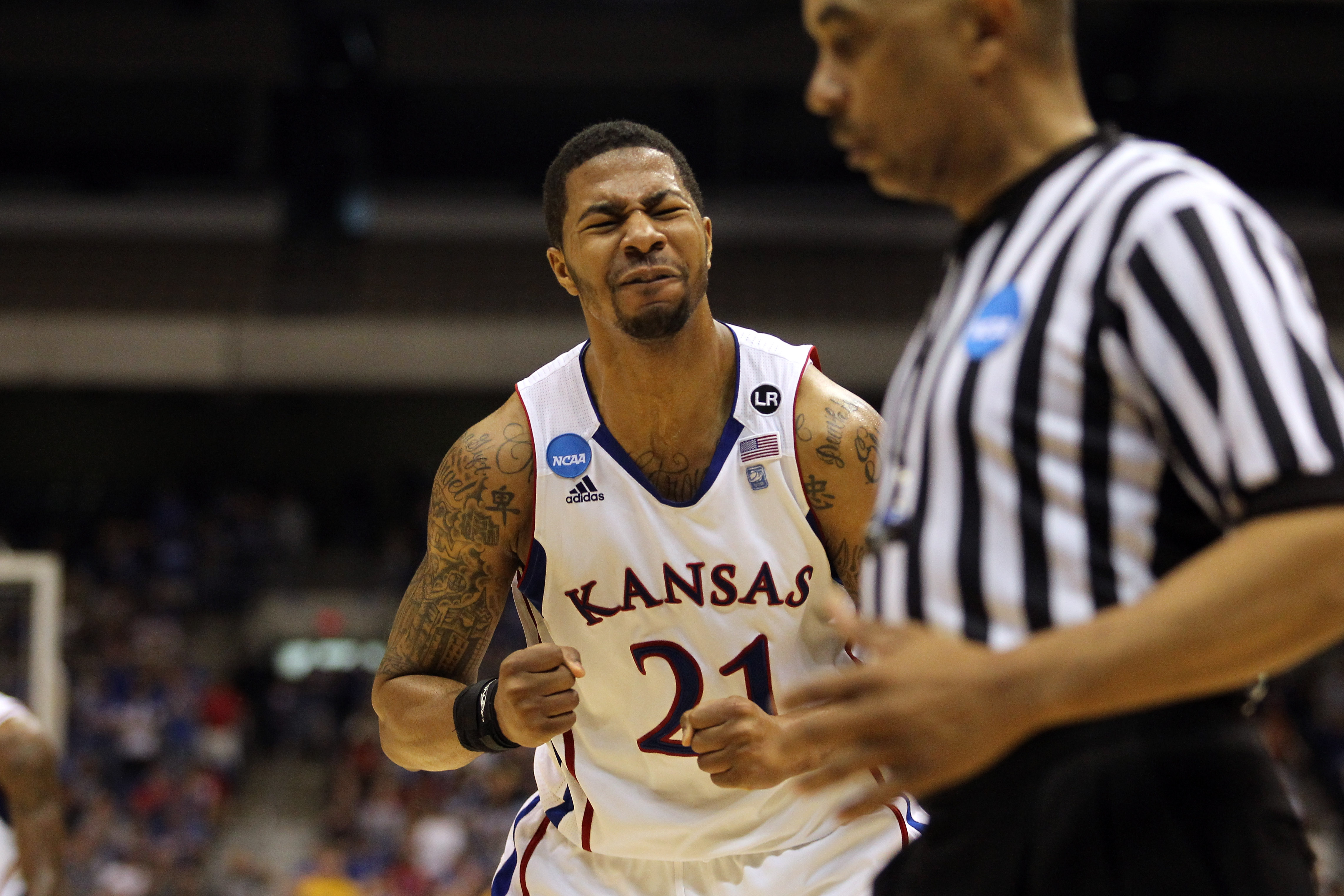 SAN ANTONIO, TX - MARCH 27:  Markieff Morris #21 of the Kansas Jayhawks reacts during the southwest regional final of the 2011 NCAA men's basketball tournament against the Virginia Commonwealth Rams at the Alamodome on March 27, 2011 in San Antonio, Texas
