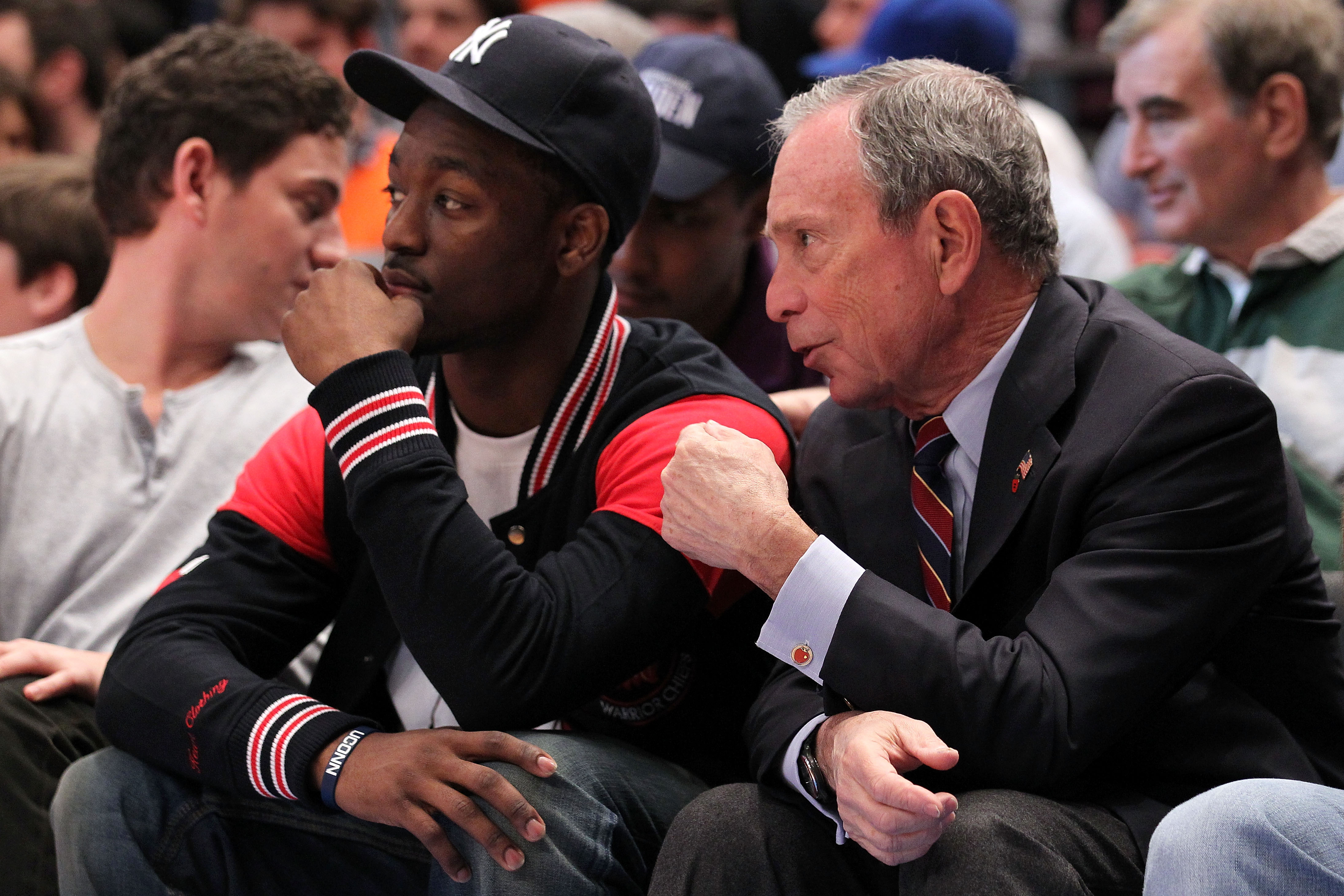 NEW YORK, NY - APRIL 24:  NBA draft prospect Kemba Walker (L) from the University of Connecticut Huskies and New York City Mayor Michael Bloomberg watch the New York Knicks play against the Boston Celtics in Game Four of the Eastern Conference Quarterfina