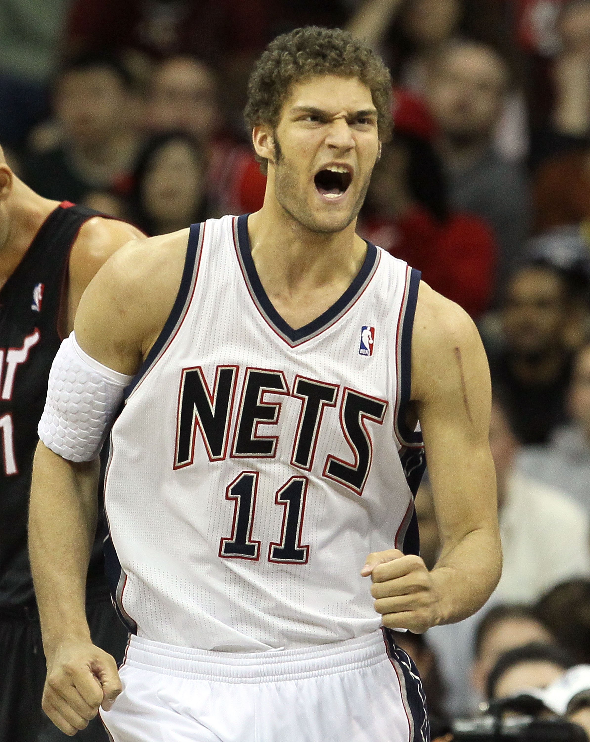 Brook Lopez of the New Jersey Nets walks past Robin Lopez of the News  Photo - Getty Images