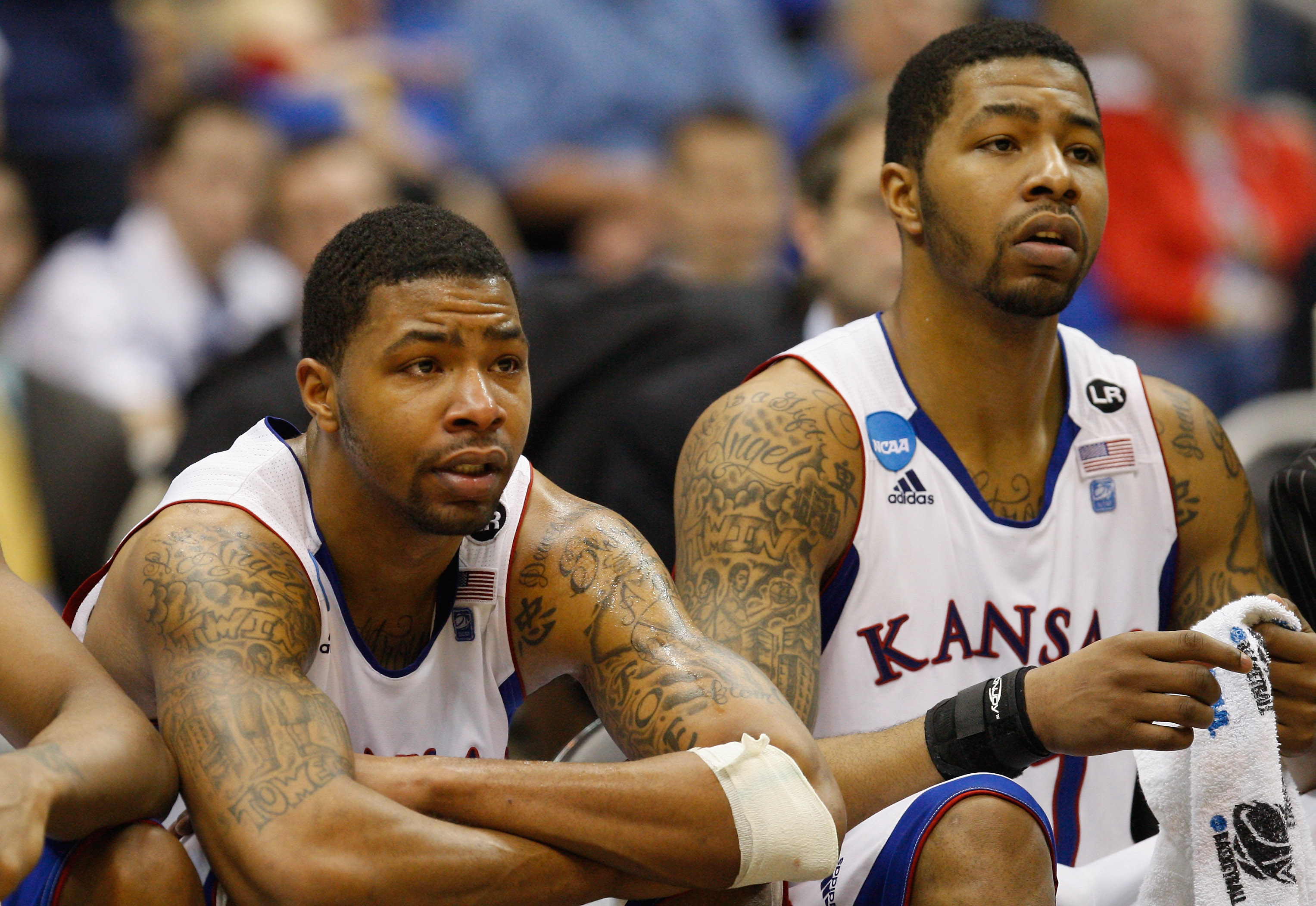 SAN ANTONIO, TX - MARCH 27:  Marcus Morris #22 and Markieff Morris #21 of the Kansas Jayhawks react during the southwest regional final of the 2011 NCAA men's basketball tournament at the Alamodome on March 27, 2011 in San Antonio, Texas. Virginia Commonw