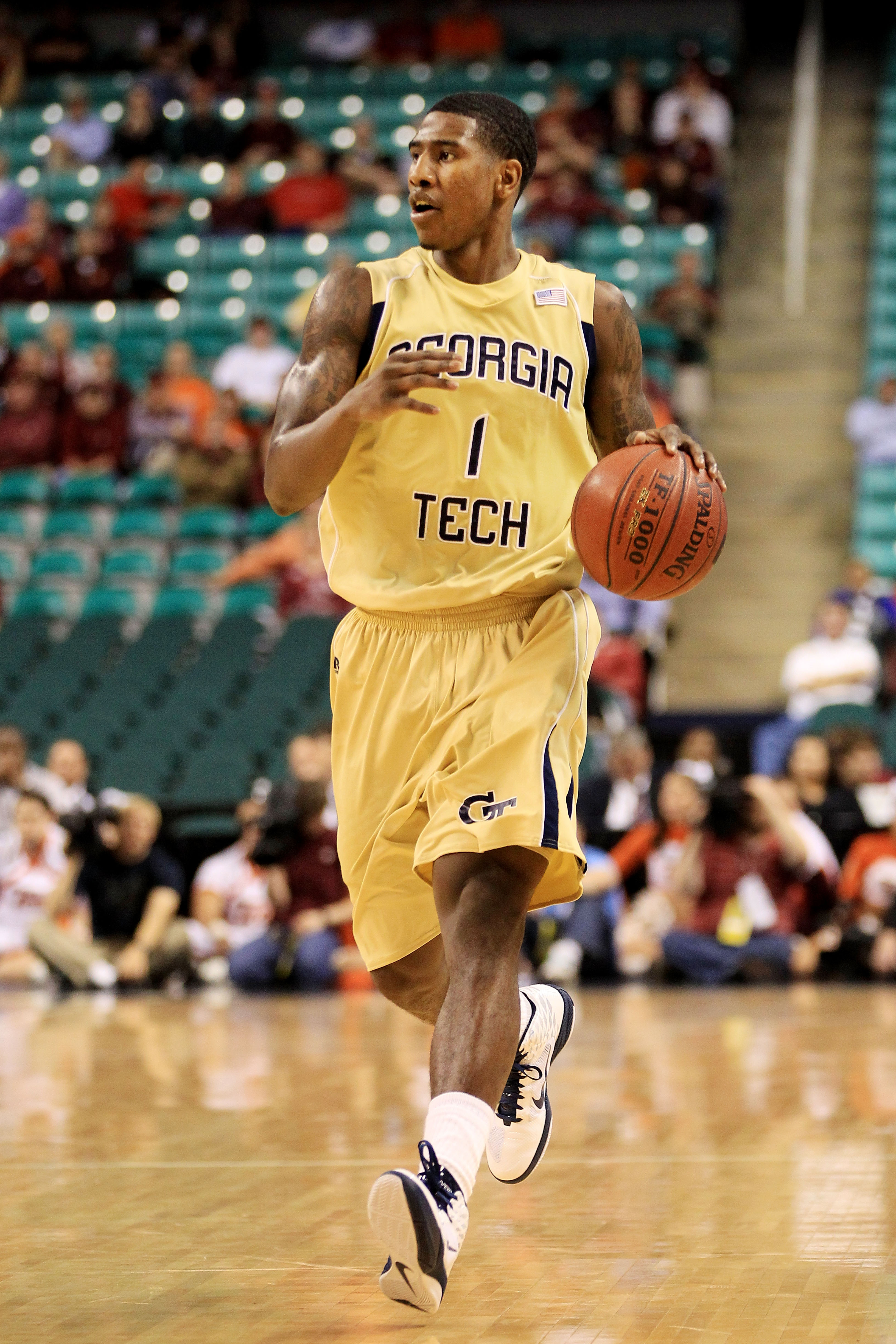GREENSBORO, NC - MARCH 10:  Iman Shumpert #1 of the Georgia Tech Yellow Jackets dribbles down the court during the second half of the game against the Virginia Tech Hokies in the first round of the 2011 ACC men's basketball tournament at the Greensboro Co