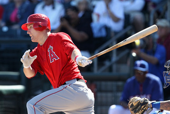 SURPRISE, AZ - MARCH 02:  Mike Trout #90 of the Los Angeles Angels of Anaheim hits a single against the Texas Rangers during the second inning of the spring training game at Surprise Stadium on March 2, 2011 in Surprise, Arizona.  (Photo by Christian Pete