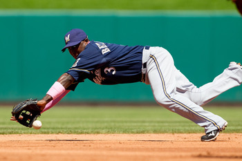 ST. LOUIS, MO - MAY 8: Yuniesky Betancourt #3 of the Milwaukee Brewers fields a ground ball against the St. Louis Cardinals at Busch Stadium on May 8, 2011 in St. Louis, Missouri.  (Photo by Dilip Vishwanat/Getty Images)