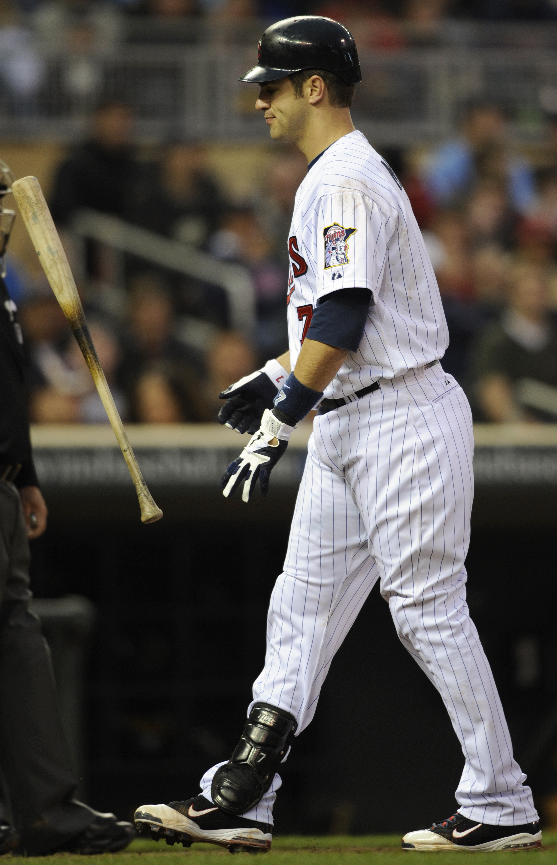 August 17, 2010; Chicago, IL, USA; San Diego Padres third baseman Miguel  Tejada (10) stands on first base after a walk during the first inning  against the Chicago Cubs at Wrigley Field.