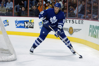 PHILADELPHIA - APRIL 9:  Jyrki Lumme #25 of the Toronto Maple Leafs skates with the puck during game one of the Eastern Conference quarterfinals of the 2003 Stanley Cup playoffs against the Philadelphia Flyers at The First Union Center on April 9, 2003 in
