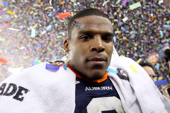 GLENDALE, AZ - JANUARY 10:  Quarterback Cameron Newton #2 of the Auburn Tigers celebrates the Tigers 22-19 victory against the Oregon Ducks in the Tostitos BCS National Championship Game at University of Phoenix Stadium on January 10, 2011 in Glendale, Ar