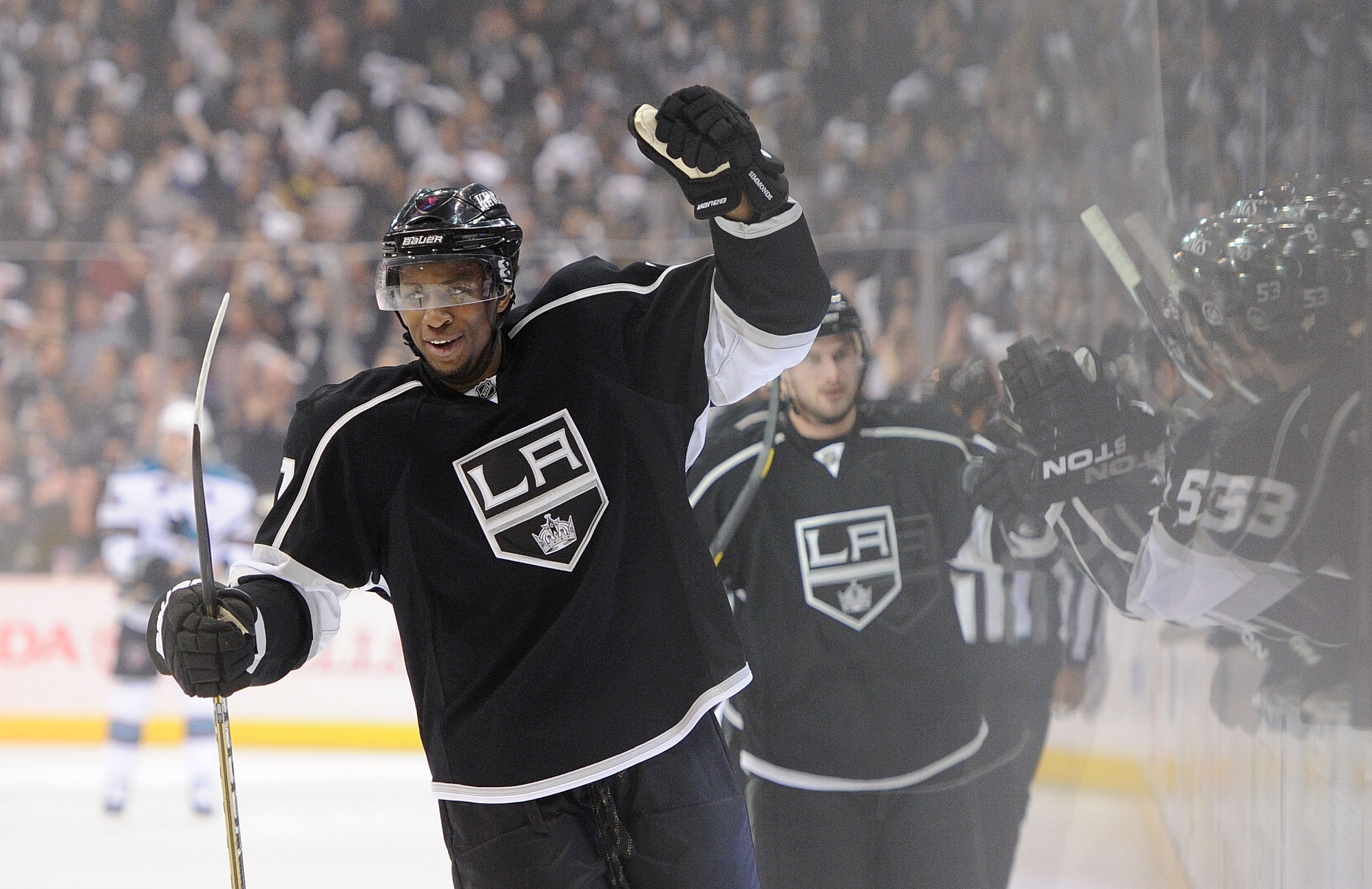 LOS ANGELES, CA - APRIL 19:  Wayne Simmonds #17 of the Los Angeles Kings celebrates after an assist on a goal by Kyle Clifford #13 against the San Jose Sharks in game three of the Western Conference Quarterfinals during the 2011 NHL Stanley Cup Playoffs a