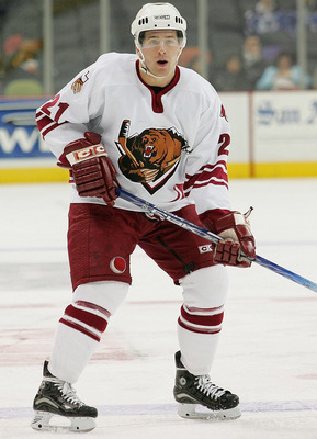 SAN ANTONIO - DECEMBER 9: Keith Ballard #21of the Utah Grizzlies eyes the play as he stands at the blueline against the San Antonio Rampage at SBC Center on December 9, 2004 in San Antonio, Texas. The Rampage won 5-0. (Photo by Darren Abate/Getty Image