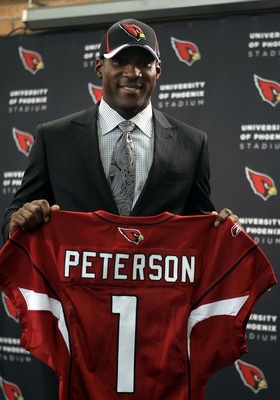 TEMPE, AZ - APRIL 29:  First round draft pick Patrick Peterson of the Arizona Cardinals poses with a team jersey during a press conference to introduce him at the team's training center auditorium on April 29, 2011 in Tempe, Arizona.  (Photo by Christian 