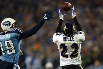 NASHVILLE, TN - JANUARY 10:  Cornerback Samari Rolle #22 of the Baltimore Ravens intercepts a pass alongside wide receiver Justin McCareins #19 of the Tennessee Titans in the second quarter during the AFC Divisional Playoff Game on January 10, 2009 at LP 